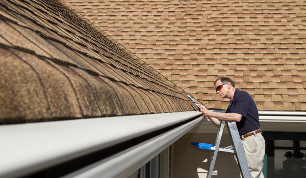 Home inspector inspecting a roof.